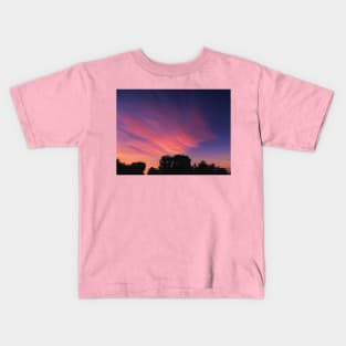 Dark Tree against a beautiful sky Kids T-Shirt